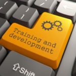 Image of keyboard enter key replacing enter with Training and Development to depict learning strategy